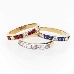 image of 3 rings with different coloured diamonds